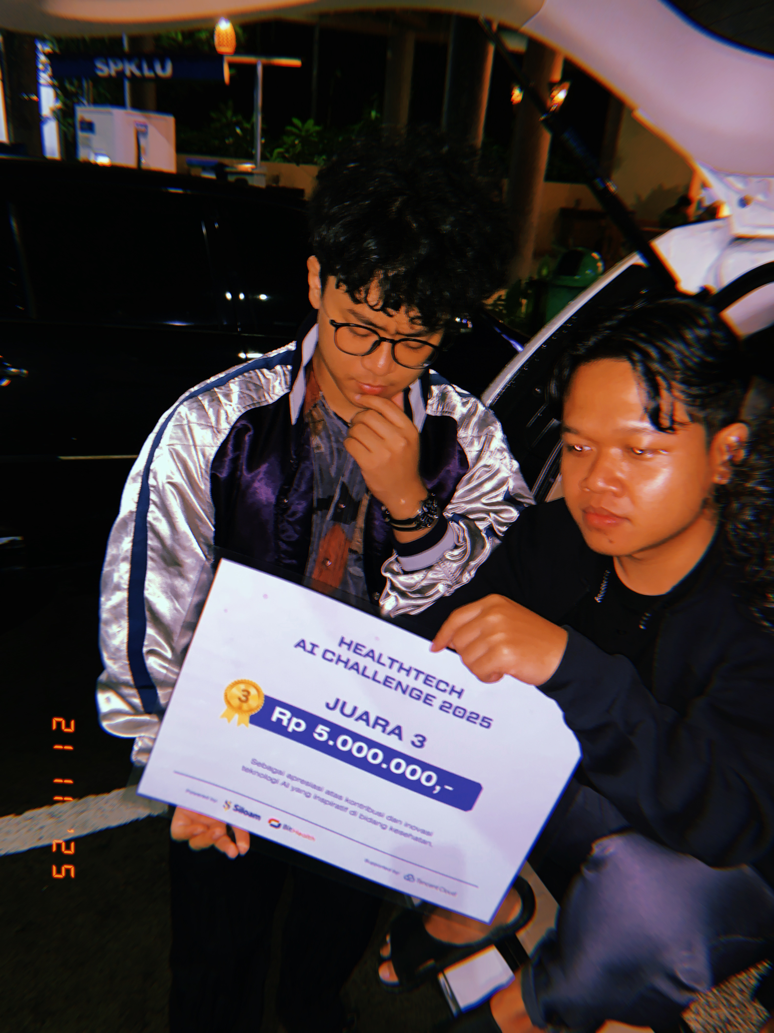 Celebrating third place at HealthTech AI Challenge 2025 with the award board