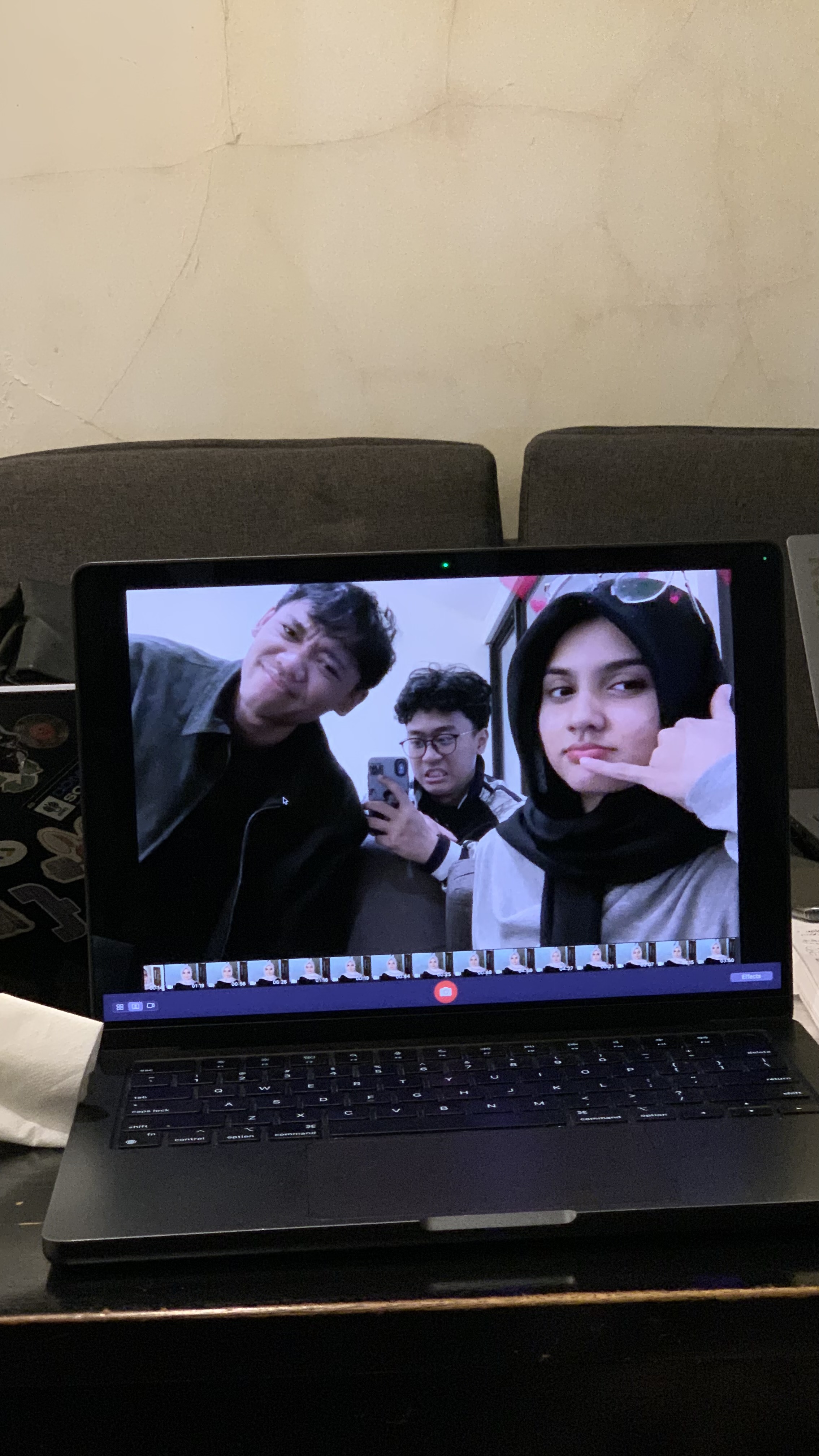 A candid laptop-camera moment during thesis days with Fadil and Zahra